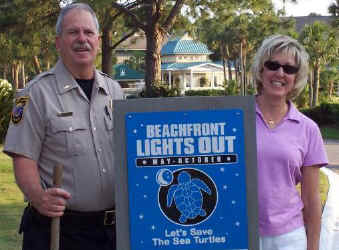 Officer Richard McCantis & Andra Kolwaski at the entrance to Fripp Island
        