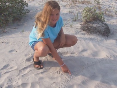 Rachel Coulomb pointing out a hatchling track, Aug.2005.