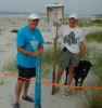 Gary and Tony prepare an information sign post for nest 1.
